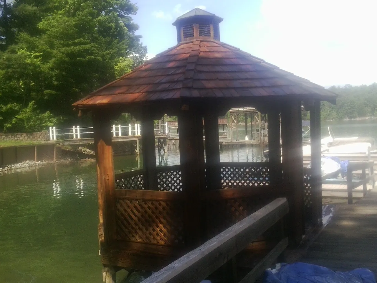 Cedar shake gazebo roof rebuilt on a lake dock in East Palestine